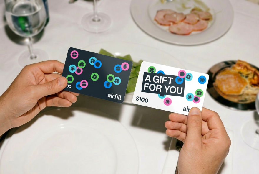 Hands holding Airfill gift cards